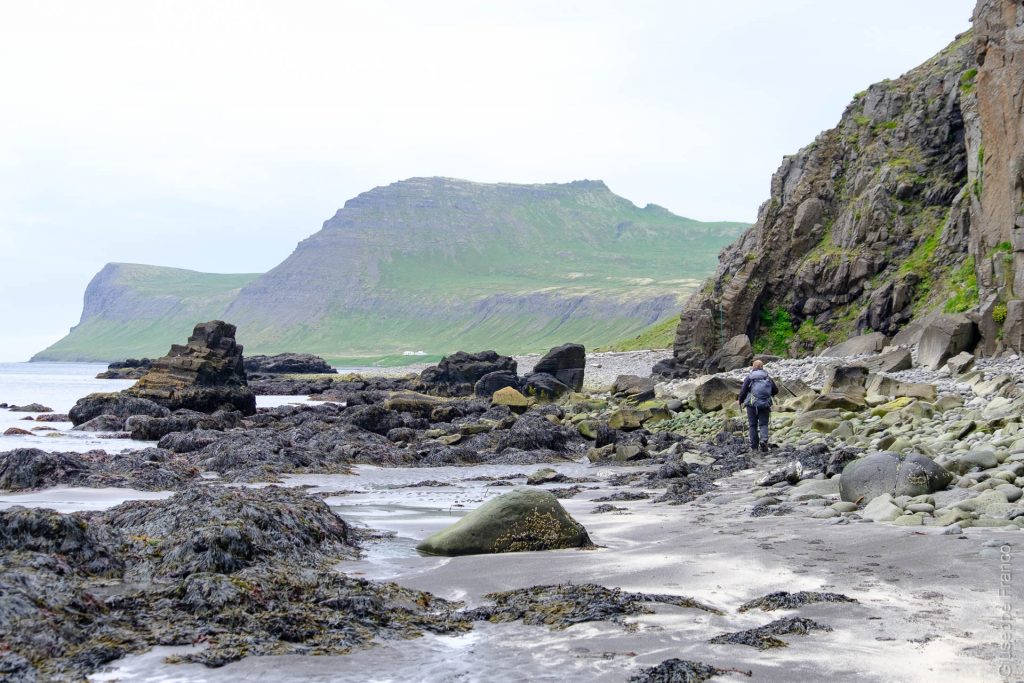 Nordstrandir - Iceland - Day2. The trail goes on the black sand beach through rocks.