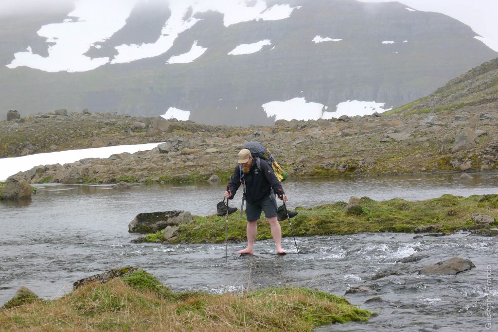 Nordstrandir - Iceland - Day3. Stepping on every single rocks  trying to avoid as much as possible the cold water.